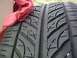 1993 Ford Probe - A close-up view of a tire, partially covered by a red cloth, with visible tread patterns.