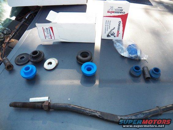 Chassis-Rite suspension parts, including bushings and a tie rod end, laid out on a surface