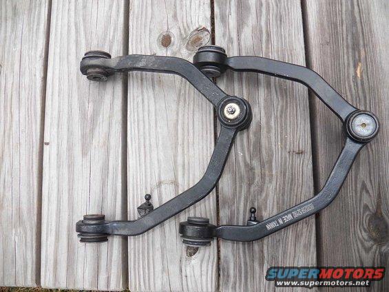 Front suspension control arms with "MADE IN TAIWAN" text visible