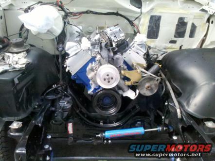 engine bay with V8 engine installed, blue shock absorber visible