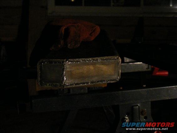 Welded metal rectangular part on a workbench