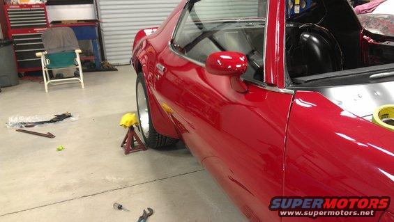 1972 Pontiac Trans Am side view, red paint, jack stand under wheel