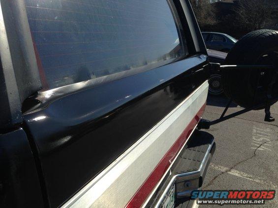 Black and silver Ford Bronco rear with spare tire mount and chrome bumper