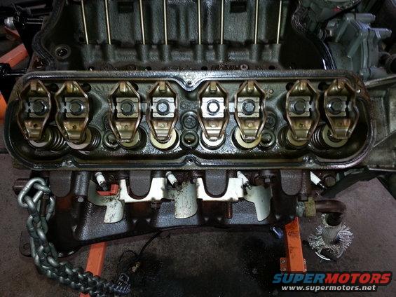 Engine valve train with rocker arms and pushrods visible
