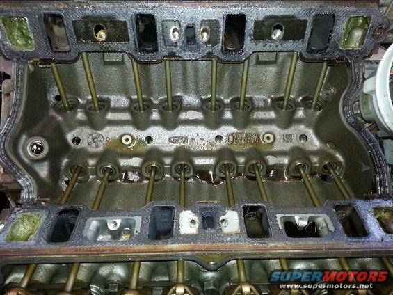 Close-up of engine cylinder heads with pushrods visible