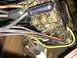 1964 Ford Ranchero - A close-up view of a vehicle's complex electrical wiring harness and fuse box, showing multiple wires and fuses.