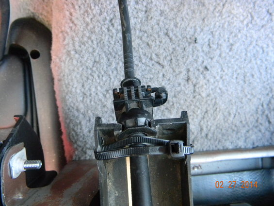 bronco-console-019.jpg drilled a hole on the left, used quick tie to hold the shift cable in, cable was a tight fit but don't want it to pop outa place.