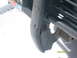 1991 Land Rover Range Rover - Close-up of a damaged front bumper corner on a 1991 Land Rover Range Rover.