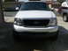 1988 Ford Bronco - This 2001 Ford F-150 is shown from the front, with another vehicle partially visible on the right side.