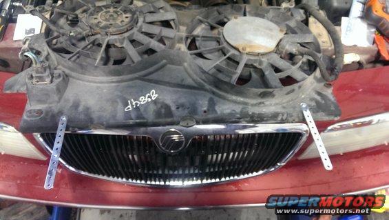 2000 Mercury Grand Marquis grille with cooling fans above. White writing on fan shroud