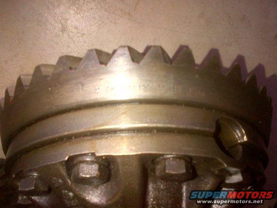 Close-up of a differential ring gear with stamped numbers visible