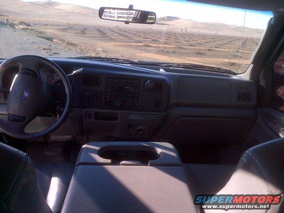 Interior view of a Ford truck, showing the dashboard, steering wheel, and center console
