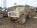 1978 Ford Bronco - This heavily modified 1978 Ford Bronco is covered in mud, oversized tires and snorkel exhaust pipes.