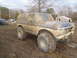 1978 Ford Bronco - This heavily modified 1978 Ford Bronco appears to be stuck in a muddy off-road course.