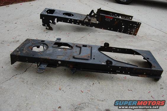 Two black metal frames for a lawn tractor, one with "HYDRO 42" visible