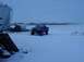 1992 Ford Bronco - A 1992 Ford Bronco sits in a snowy field, its soft top removed, with a grain silo to its left.