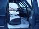 1992 Ford Bronco - The interior of a 1992 Ford Bronco is visible, with snow covering the seats and floor.