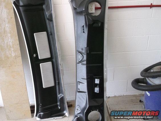 two black car interior trim panels, one with silver vents