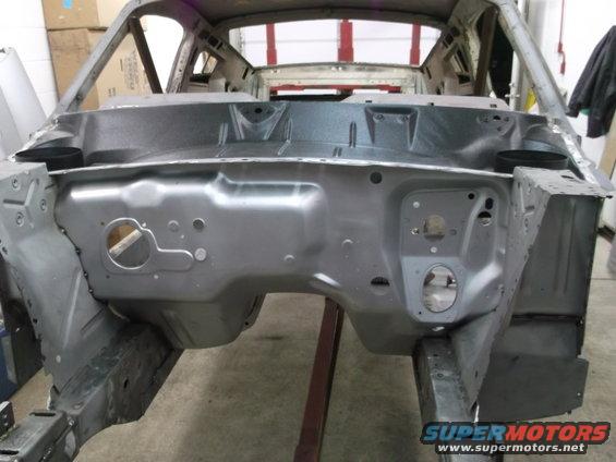 1967 Ford Mustang chassis, front view, bare metal, undergoing restoration