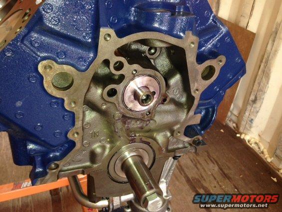 Engine block painted blue, showing crankshaft and front seal area
