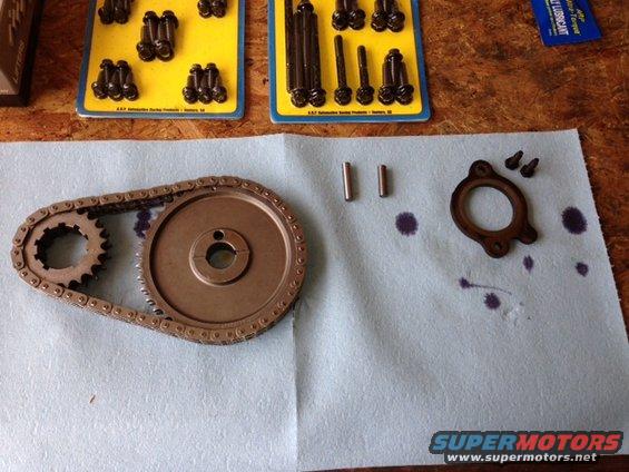 Timing chain and gears with pins and gasket on a blue shop towel