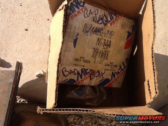 Cardboard box with Mellings M-34A engine parts and handwritten notes