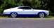 1964 Mercury Monterey - This two-door coupe features a white body with a blue lower accent and custom five-spoke wheels.