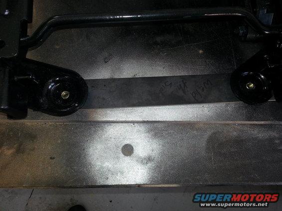 Black seat bracket with visible weld marks