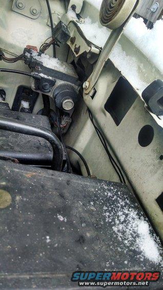 Engine bay wiring and components covered in snow