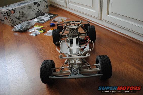 Remote control car chassis with suspension and electronics