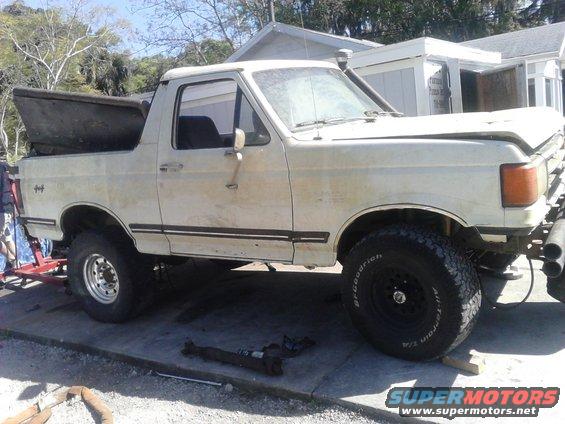 DAY 1:

I just finished scrapping my old 96 yesterday. I have parts laying EVERYWHERE and they need to be used ASAP. The rear axle was the biggest part and not easy to store so it gets swapped im first. Plus my old one im selling to a friend who needed it quickly for his project

to save time I left the axle, shocks, swaybar, leafsprings, and even wheels all together and just unbolted the leafs from the shackle and disconnect everything else. rolled the old out and new in and reattached.

The new axle is a Dana 60 Semi-Floating out of a ~2000 E-250. it has factory 4.10 gears, disk brakes, and is about 4\\" wider than a normal axle. Because it came out of my 96 Bronco, I already welded on new spring perches with corrected pinion angle (no more factory angle block needed), have a custom driveshaft, swaybar modified, and brakes setup for easy install. I LOVE THIS AXLE, was the best upgrade I did on that truck and hope it will still be as good on this.

The leaf springs are from a ~92-96 F250. they are stronger than the stock ones, bolt right in place, and add a 2-3 inches of lift. I do have 3 inch blocks (yes I know everybody hates blocks) with some very heavy duty U-bolts. for all the time they were on my old 96 and jumped for soo long I never had a slightest problem so I kept them.

the 2-3 inches of lift from the F250 leafs and the 3 inch block means I have somewhere around 5 to 6 inches of lift. That\\'s all I need as this truck is not more of a general purpose trail truck than only a mudtruck. 
