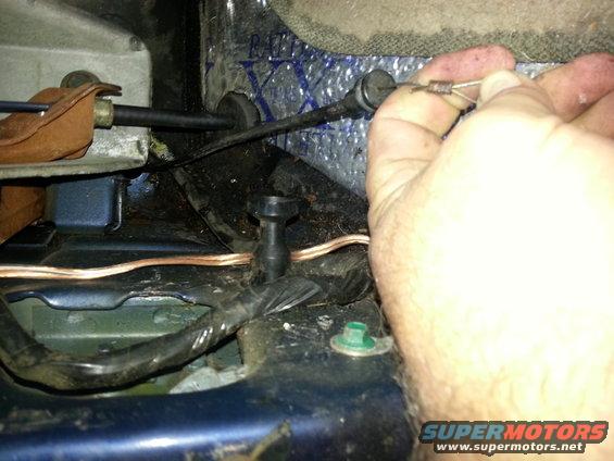 Hand adjusting cable release mechanism under car