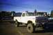 1976 Ford F-150 - This lifted 1976 Ford F-150 pickup truck is parked outdoors on pavement.