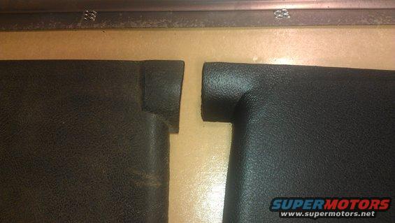 Close-up of a car's interior door panel and window crank