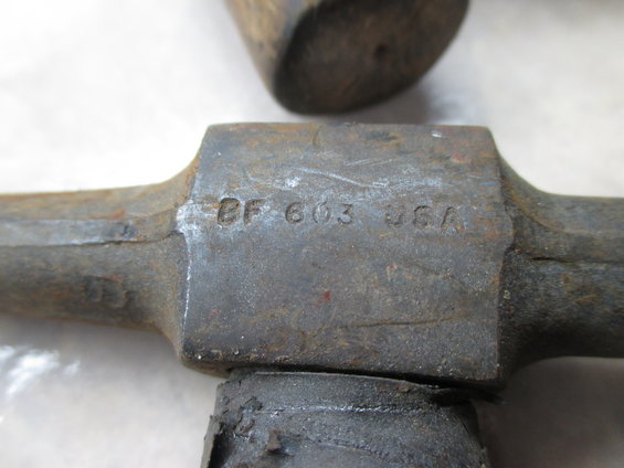 Close-up of a metal part with "BF 603 USA" stamped on it