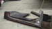 1979 Ford Bronco - Car door sill and rocker panel sections are laid out on a concrete floor.