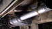 1979 Ford Bronco - Close-up of the vehicle's exhaust system, showing the muffler and piping.