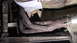 1979 Ford Bronco - Underside view of a vehicle's exhaust system, showing rusted components and a watermark.