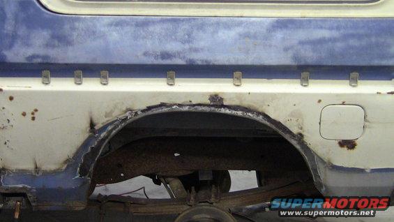 1979 Ford Bronco rear wheel arch with rust and damage