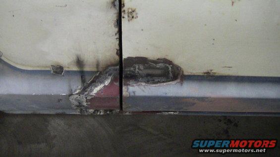 rusted door bottom with repair patch