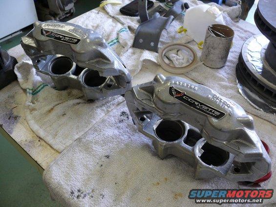 Corvette brake calipers with "CORVETTE STINGRAY" text and emblem, on towels