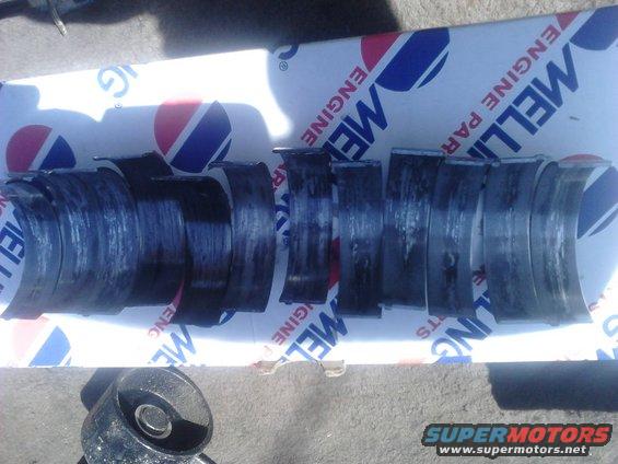 p82a0213.jpg DAY 3:

pulled the tranny and transfer case. tranny needs a rebuild as the clutches burned up and it wont shift into 3rd. will probably sell as a core. transfer case I sold

I started disassembling the seized engine to figure out what caused it to go bad. took the intake and heads off and found nothing wrong there. took the pan off and it became very clean a bearing was the cause as there was metal flakes everywhere. unbolting all the main caps showed extreme wear with deep grooves, to ill present, and bearings in horrible shape. Taking the rod caps off showed the same but the #2 and #6 rod bearings (which are together on the crank) were obviously the cause. the bearings were actually missing and the caps were banged up bad enough that I had to cut them off to disconnect them.

this was a remanufactured crankshaft and came with matching 10/10 bearings, I used a lot of assembly lube, primed the oil pump, and checked clearances. don\\'t know why the bearing originally had a problem. im assuming that the bearing must have spun, seized on the crank but the engine didn\\'t seize the engine. it spun until it flaked apart and the cleacence became soo much that all the oil pressure was going to it instead of the others. the others without oil pressure would then eventually lock up till it seized the engine.

good news is that the engine is still useable. I have the original crank which is in pristine condition (no grooves at all). everything is good to reuse but it will need 2 new connecting rods, new bearings, oil pump, pickup screen, gaskets. also I plan on using it instead of the 302 from my old truck so I have more power.
 


