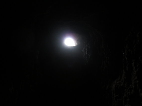 light shining through a dark cave opening