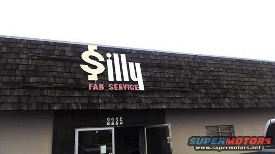 Building with "Silly Fab Service" sign and address 2225