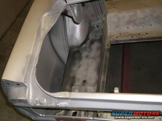 Silver 1967 Ford Mustang trunk interior showing metalwork and primer