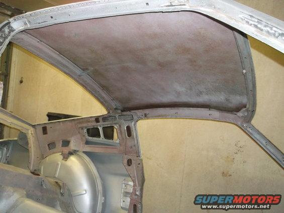 car's bare metal roof structure, showing the interior frame and headliner support