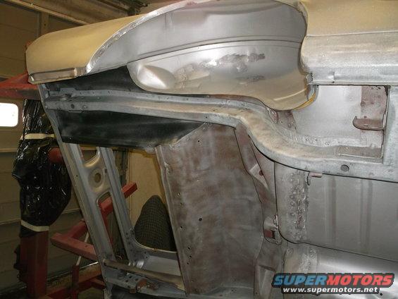 car body being worked on, showing inner structure and metalwork