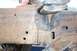 1990 Ford Bronco - Rusted vehicle frame shows a significant crack near a mounting bracket.