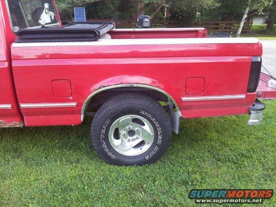 smaked tails extang tri fecta cover and dodge wheels with 265 75 16 tires
