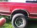 1995 Ford F-150 - This 1995 Ford F-150 shows rust around the rear wheel well, a common issue for trucks of this era.